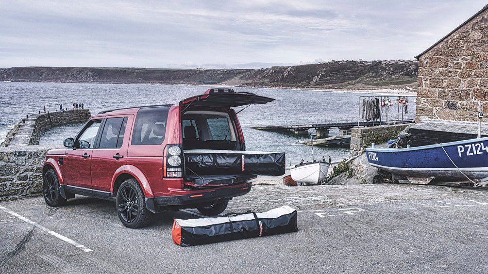 MiniCat inflatable sailboat packed into compact bags fitting in a car boot or campervan