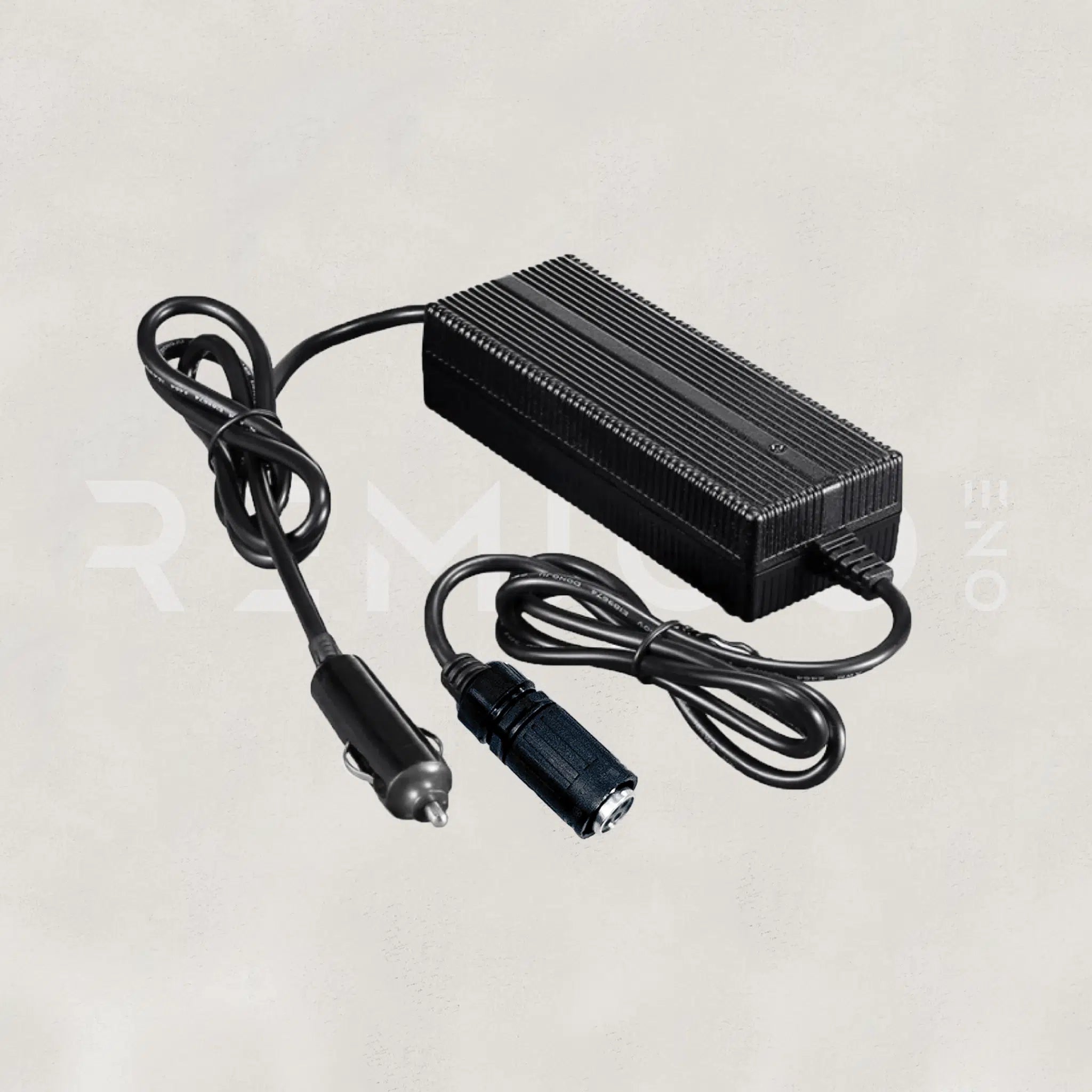 Black power adapter with cable on a light gray background