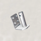 Metal bracket with cylindrical component on a light gray background, featuring the brand 'REMIGO'.