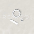 Metallic hardware components on a light gray background